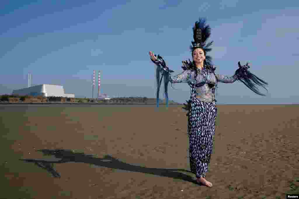 Winner of Junk Kouture world designer of the year Clodagh Ramsey, 17, from Wilso's Hospital School in County Westmeath, poses in her dress called 'Aquacultural,' an organic waste design she made from around 2,000 mussel shells championing sustainable food production, on Sandymount beach, in Dublin, Ireland.