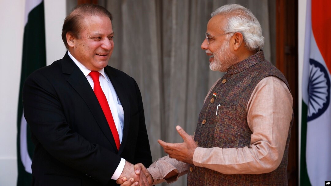 Indian Prime Minister Narendra Modi, right, shakes hand with his Pakistani counterpart Nawaz Sharif before the start of their meeting in New Delhi, India, May 27, 2014.