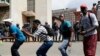 South Africa University Protests: Protesting students from the University of the Witswatersrand sing outside the Hillbrow Magistrate’s Court in Johannesburg, South Africa, Wednesday, Oct. 12, 2016, in support of their peers who were arrested earlier this week.