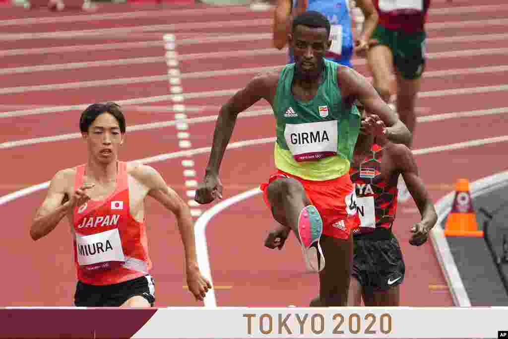 Lamecha Girma, of Ethiopia, wins in a heat of the men's 3,000-meter steeplechase at the 2020 Summer Olympics, Friday, July 30, 2021, in Tokyo. (AP Photo/Charlie Riedel)