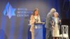 FILE - A survivor of Hamas' Oct. 7, 2023 terror attack, Natalie Sanandaji, left, accepts the Simon Wiesenthal Center's Medal of Valor and another award in New York, Sept. 12, 2024. She participated in a video made to demonstrate solidarity with Iranian women resisting oppression.