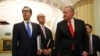 Treasury Secretary Steven Mnuchin, left, accompanied by White House Legislative Affairs Director Eric Ueland and acting White House chief of staff Mark Meadows, speaks with reporters as he walks to the offices of Senate Majority Leader Mitch McConnell