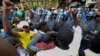 Protesters clash with police near parliament in Cape Town, South Africa, Feb. 9, 2017 prior to it's opening and a national address by President Jacob Zuma. Hundreds of armed forces have been deployed to increase security as opposition groups denounce Zuma, saying he should resign.