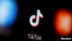 A TikTok logo is displayed on a smartphone in this illustration.