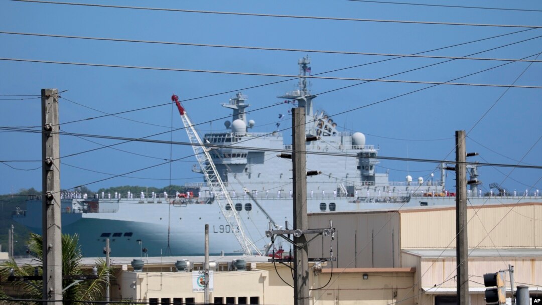 FS Mistral, a French amphibious assault ship, pulls into port at Naval Base Guam, May 11, 2017, near Hagatna, Guam. Troops from the United States, Japan, France and the United Kingdom are gathering for drills they say will show support for the free passage of vessels in international waters.