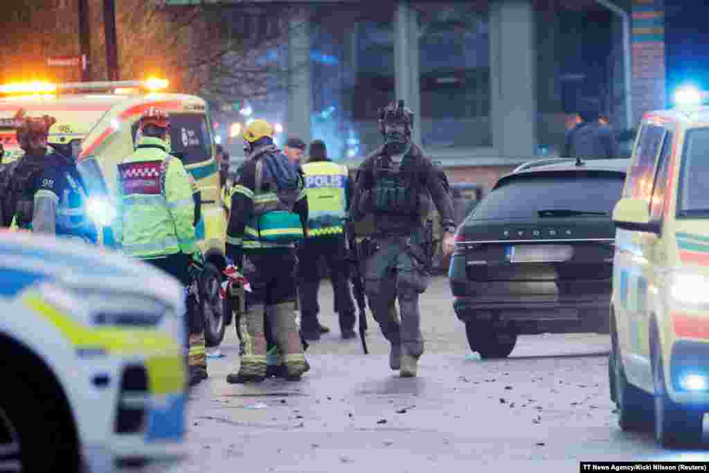 Emergency personnel and police officers work at the adult education center Campus Risbergska school after a shooting attack in Orebro, Sweden. At least 10 people have been killed in the shooting, Swedish police said. 