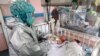 An Afghan nurse attends to newborn children who lost their mothers in an attack at a hospital, in Kabul, Afghanistan. Gunmen burst into the hospital&rsquo;s maternity ward and started shooting. The attack killed 24 people, including two newborns and at least six babies lost their mothers.