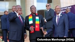 South African President Cyril Ramaphosa, Zimbabwean President Emmerson Mnangagwa, Botswanan President Duma Boko and SADC Executive Secretary Elias Magosi gather before their meeting on the conflict in DRC, in Mount Hampden, Zimbabwe, on Jan. 31, 2025.