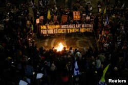 Relatives and supporters of hostages kidnapped during Hamas' Oct. 7, 2023, attack on Israel gather in Tel Aviv, Israel, to demand the release of all hostages, March 8, 2025.