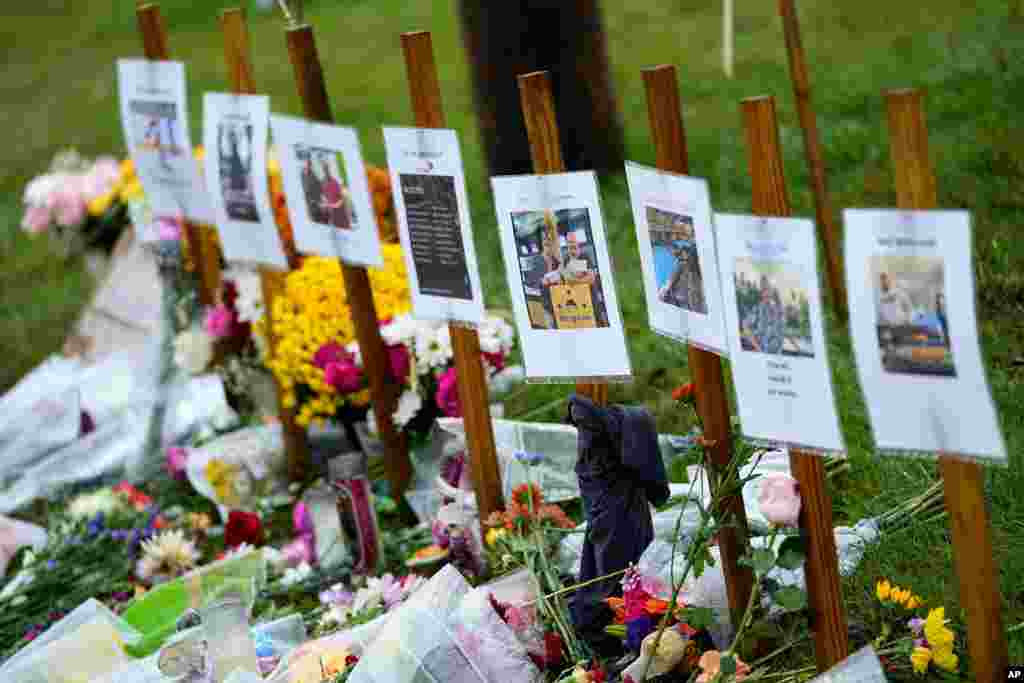 Rain soaked memorials for those who died sit along the roadside by Schemengees Bar & Grille, Oct. 30, 2023, in Lewiston, Maine. The deadliest mass shooting in Maine history propelled homicides to a new high in the state in 2023, hitting at least 50 to shatter the previous record as the end of the year approaches, officials said.