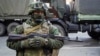 FILE - A pro-Russia rebel stands guard in Donetsk, eastern Ukraine, Oct. 29, 2015.