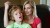 Colleen Jankovich looks over her 11-year-old autistic son, Matthew, who is non-verbal and requires 24/7 care, in Omaha, Nebraska, May 23, 2014.