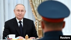 FILE PHOTO: Russian President Putin meets with servicemen involved in Russia-Ukraine conflict, in Moscow