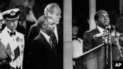 During the Independence celebrations, on April 18, 1980, Prime Minister Robert Mugabe takes the oath of allegiance to Zimbabwe in Highfields, Harare, Zimbabwe.