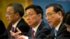 Chinese Premier Li Keqiang (R) is flanked by Vice Premiers Hu Chunhua (L) and Han Zheng during a press conference in Beijing, March 20, 2018. The premiere appealed to Washington to 'act rationally' and avoid disrupting trade. 