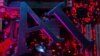 FILE - The letters AI (for Artificial Intelligence) and a robot's hand are seen in this illustration photo taken June 23, 2023. A new report says the emergence of cheap artificial intelligence tools is leading to a wave of biometric fraud in Africa. 