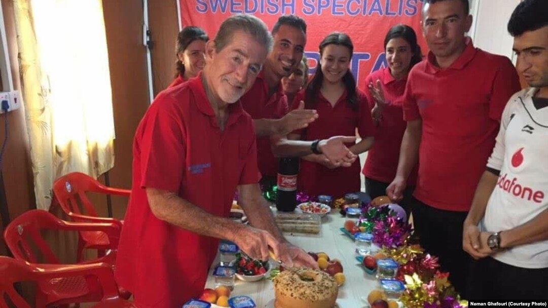 FILE - Leland Scott celebrates his birthday with his students at the Bajid Kandall 2 Yazidi refugee camp in Iraqi Kurdistan region, May 17, 2016.