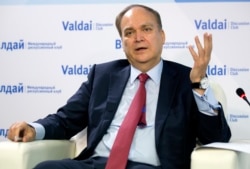 FILE - Anatoly Antonov, Russian ambassador to the U.S., gestures while speaking during a round-table discussion on the Trump-Putin summit in Helsinki in Moscow, Russia, July 20, 2018.