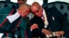 FILE - South African President Jacob Zuma, right, exchanges words with Chief Justice Mogoeng Mogoeng, left, at the inauguration ceremony of Zuma, in Pretoria, May 24, 2014.