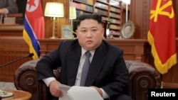 North Korean leader Kim Jong Un poses for photos in Pyongyang in this Jan. 1, 2019, photo released by North Korea's Korean Central News Agency (KCNA). 