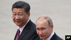 中國領導人習近平（左）與俄羅斯總統普京。