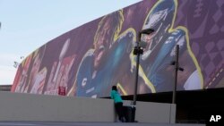 A person stands outside the Superdome on Feb. 3, 2025, in advance of the upcoming Super Bowl to be played Jan. 9 in New Orleans.