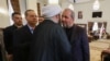 Iraqis offer their condolences to Iranian Ambassador Muhammad Kazem al-Sadiq, right, for the death of the Islamic republic's late president Ebrahim Raisi during a service on May 20, 2024 for the president and his entourage, who were killed in a helicopter crash.