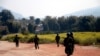 FILE - Myanmar army soldiers carrying weapons patrol on a road as part of operations against ethnic rebels, in Kokang, northeastern Shan State, more than 800 kilometers (500 miles) northeast of Yangon, Myanmar.