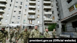 UKRAINE – In the center (from left to right): NSDC Secretary Oleksandr Turchinov, President of Ukraine Petro Poroshenko and Head of Donetsk Regional State Administration Oleksandr Kuts. The city of Avdiyivka, near the occupied Donetsk, May 6, 2019