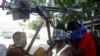 In this photo taken Thursday, Dec. 25, 2014, Suspected Al-Shabab militant captured during Thursday's attack on African Union base are seen in Mogadishu, Somalia.
