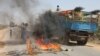 A truck passing a partial roadblock setup by residents as a protest against the Islamist Al-Shabab insurgent group, in Tobanka Buundo in the lower Shabelle region, near the Somalian capital Mogadishu, March 6, 2014.