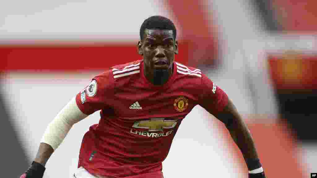 Paul Pogba, Manchester United - Midfielder Manchester United midfielder Paul Pogba was removed from the France squad for UEFA Nations League in late August after testing positive for the coronavirus. Pogba returned to training with Manchester United in mid-September following isolation. Photo: Manchester United's Paul Pogba runs with the ball during the English Premier League soccer match between Manchester United and Tottenham Hotspur at Old Trafford in Manchester, England, Sunday, Oct. 4, 2020. (Carl Recine/Pool via AP)