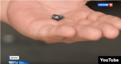 Shrapnel displayed by an investigator after the bombing. (Screengrab from "News of the Week with Dmitry Kisleyov, Rossiya 1).