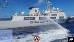 FILE - In this handout photo provided by the Philippine Coast Guard, a Chinese coast guard ship uses water canons on a Philippine Coast Guard ship near the Philippine-occupied Second Thomas Shoal, South China Sea, as they blocked it's path during a re-supply mission Aug. 5, 2023.