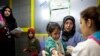 FILE - A Syrian girl weeps after receiving the measles vaccine from UNICEF nurses at the U.N. refugee agency's registration center in Zahleh, in Lebanon's Bekaa Valley.