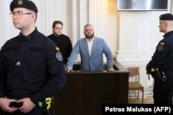 LITHUANIA -- Russian citizen and former Soviet military official, Yury Mel (C) takes part in a hearing in the trial over Moscow's deadly 1991 Soviet crackdown on the Baltic state's independence movement, in a regional court in Vilnius, March 27, 2019