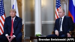 Russian President Vladimir Putin (R) and US President Donald Trump attend a meeting in Helsinki, on July 16, 2018. (Photo by Brendan SMIALOWSKI/AFP.