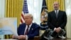 Howard Lutnick, President Donald Trump's choice to serve as commerce secretary, listens as Trump speaks after signing an executive order in the Oval Office of the White House, Feb. 13, 2025, in Washington.