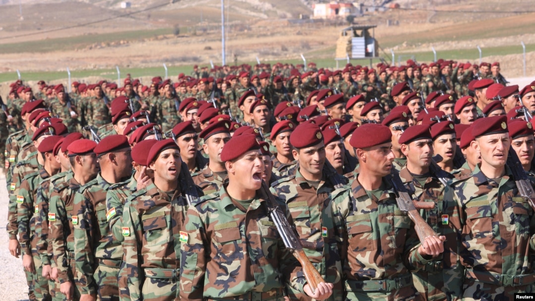 A group of Arab soldiers who have joined Kurdish peshmerga forces take part in their graduation ceremony at a training camp in Duhok province, Iraq, Feb. 7, 2017.