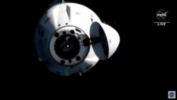 In this image from video provided by NASA, astronauts in the SpaceX Dragon capsule undock from the International Space Station on Nov. 8, 2021.