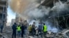 Petugas damkar berupaya memadamkan api di lokasi serangan udara Israel di lingkungan Ghobeiry di pinggiran selatan Beirut pada 15 November 2024.