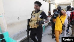 FILE - Former police officer Jimmy "Barbecue" Cherizier addresses the media, in Port-au-Prince on March 11, 2024. Cherizier is the leader of an alliance of armed gangs in the Haitian capital.