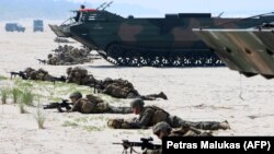 LITHUANIA -- NATO troops take part in a massive amphibious landing during the Exercise Baltic Operations (BALTOPS), a NATO maritime-focused military multinational exercise, in Nemirseta on the Baltic sea, June 4, 2018
