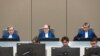 Judge Cuno Tarfusser (C), judge Chang-ho Chung (R) and judge Marc Perrin de Brichambautat (L) issue a ruling on South Africa's failure to arrest Omar al-Bashir, during a session of the ICC in The Hague, July 6, 2017.