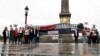 FILE - Reporters Without Borders activists in Paris demonstrate against restrictions on the press in Egypt and call for the release of detained journalists there, Oct. 24, 2017. Dozens of journalists gathered recently in Cairo to show solidarity with jailed colleagues. 