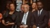 FILE - Former political prisoner Ahmed Kathrada, center, and wife of former president Nelson Mandela, Graca Machel, left, at the South African premier of the film "Mandela - Long Walk To Freedom," in Johannesburg, Nov. 3, 2013. Actor Idris Elba, who stars as Mandela, is at right.