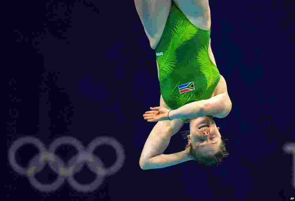 Micaela Bouter of South Africa competes in women's diving 3m springboard preliminary at the Tokyo Aquatics Centre at the 2020 Summer Olympics, Friday, July 30, 2021, in Tokyo, Japan. (AP Photo/Dmitri Lovetsky)