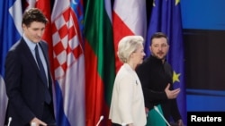Ukrainian President Volodymyr Zelenskyy, European Commission President Ursula von der Leyen, and Canada's Prime Minister Justin Trudeau attend a press conference after the "Support Ukraine" summit in Kyiv, Ukraine, Feb. 24, 2025.