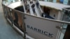 FILE - The logo of sponsor Barrick Gold Corporation is seen as visitors arrive at the Prospectors and Developers Association of Canada (PDAC) annual convention in Toronto, Canada March 4, 2019. 