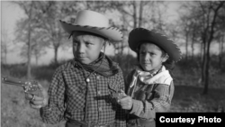 Robert “Corky” and Linda Poolaw (Kiowa/Delaware), dressed up and posed for the photo by their father, Horace. Anadarko, Oklahoma, ca. 1947. 45HPF57 © 2014 Estate of Horace Poolaw. Reprinted with permission.